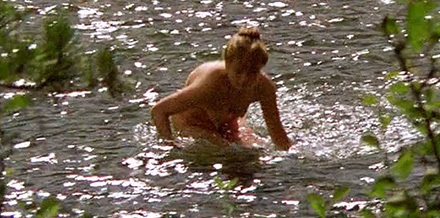 Naked woman urinates directly into the river (PWSM0186)