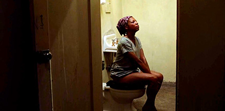 Ebony woman pissing in the prison toilet (PWSM0192)